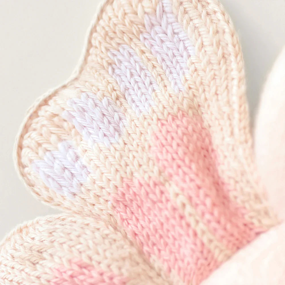 Cuddle + Kind hand-knit baby butterfly toy in petal pink, alternate view