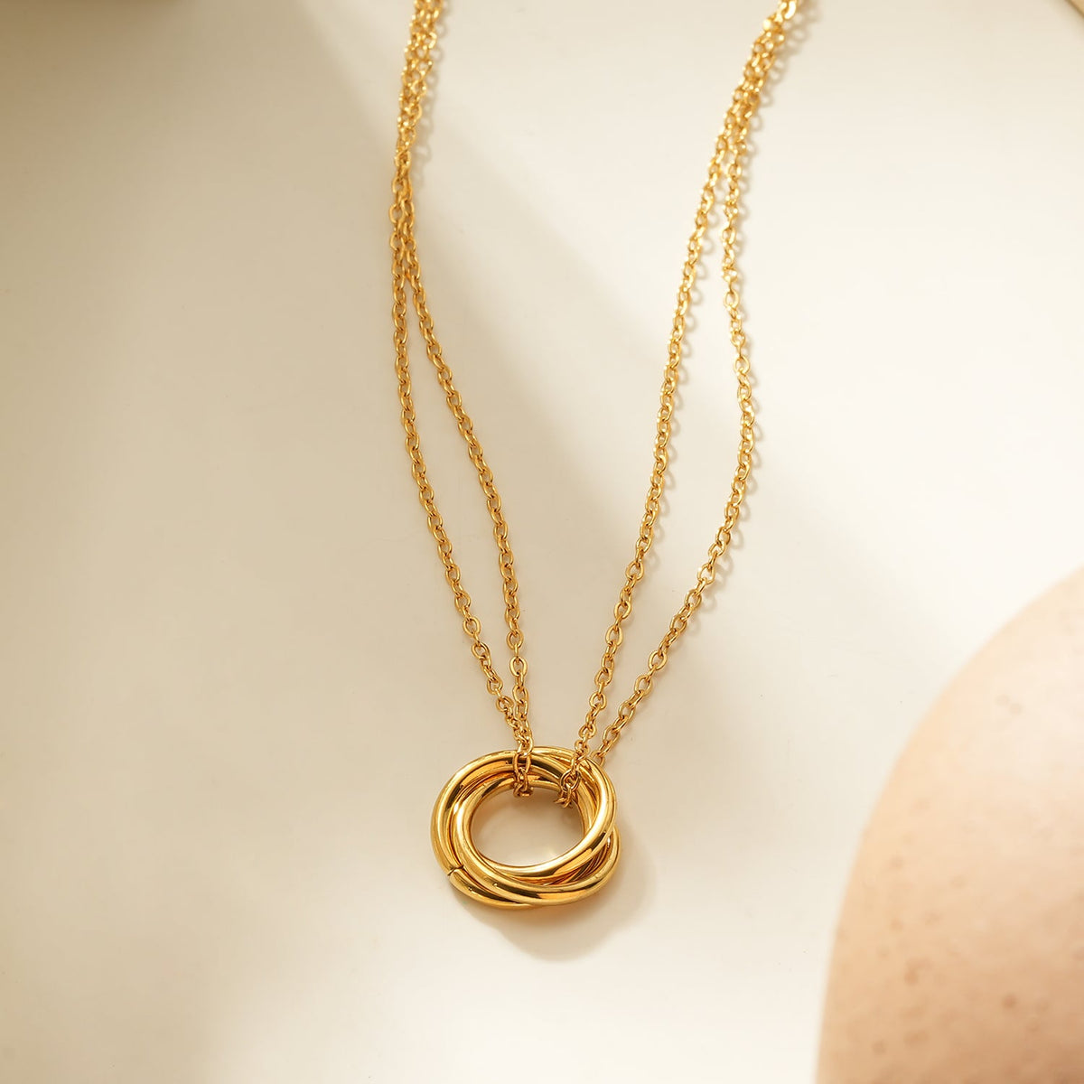HACKNEY NINE ELVIRA gold double chain necklace with intertwined three-ring pendant