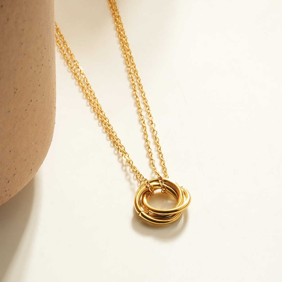 HACKNEY NINE ELVIRA gold double chain necklace with intertwined three-ring pendant, alternate view
