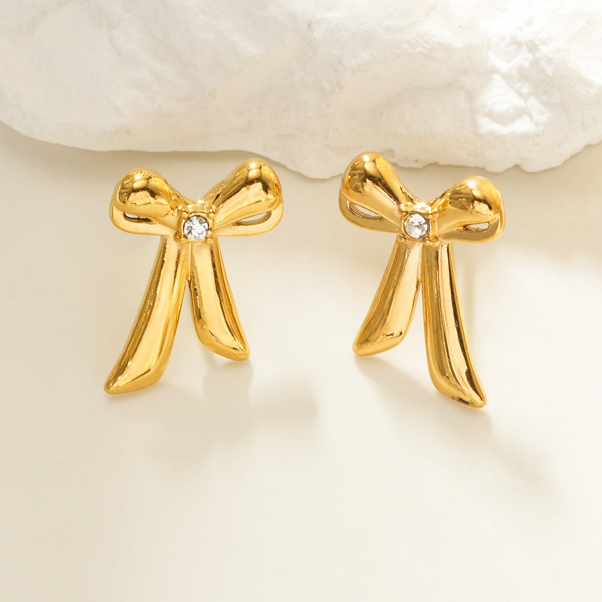 HACKNEY NINE SAMANTHA gold bow stud earrings with solitaire zirconia, alternate view