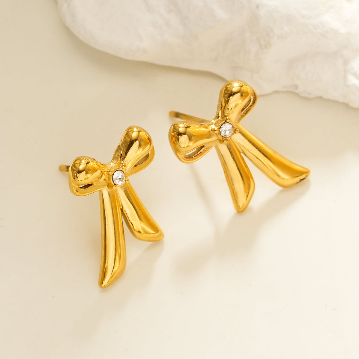 HACKNEY NINE SAMANTHA gold bow stud earrings with solitaire zirconia, alternate view