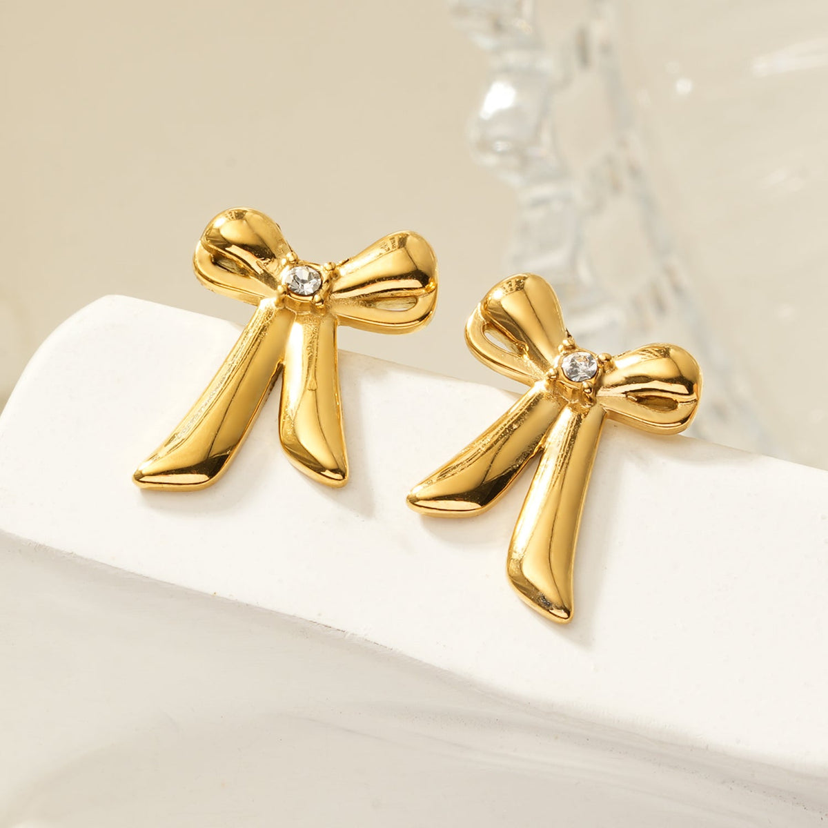 HACKNEY NINE SAMANTHA gold bow stud earrings with solitaire zirconia, alternate view