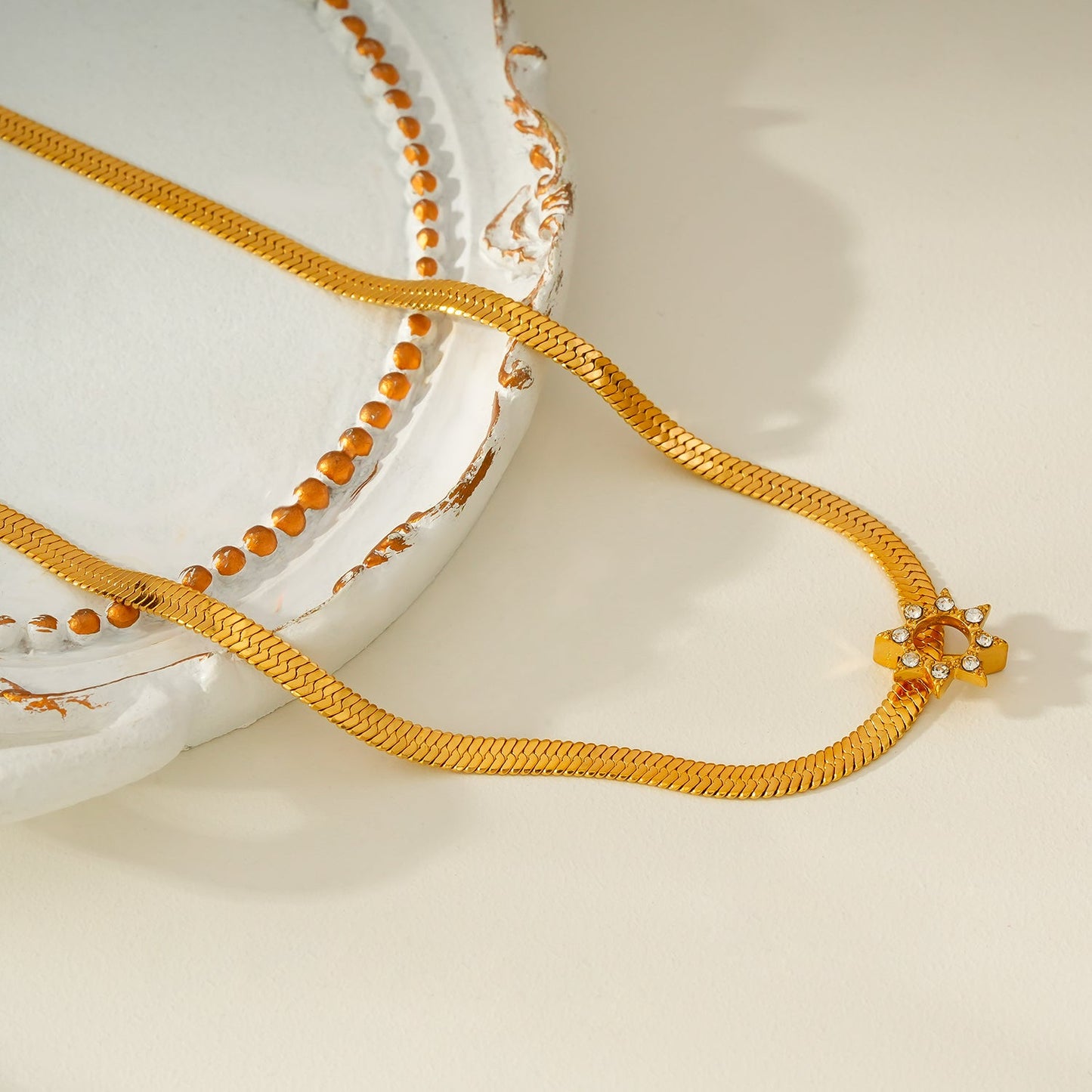 AGULHAS Gold: Celestial Elegance - Snake Skin Chain Necklace with Zirconia Embedded Star Charm